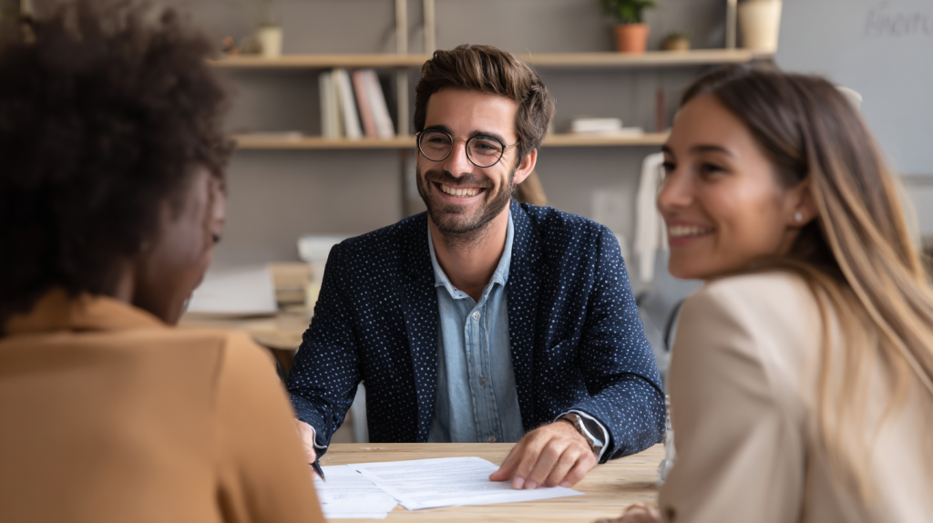 A migration agent assisting his clients with partner visa paperwork.